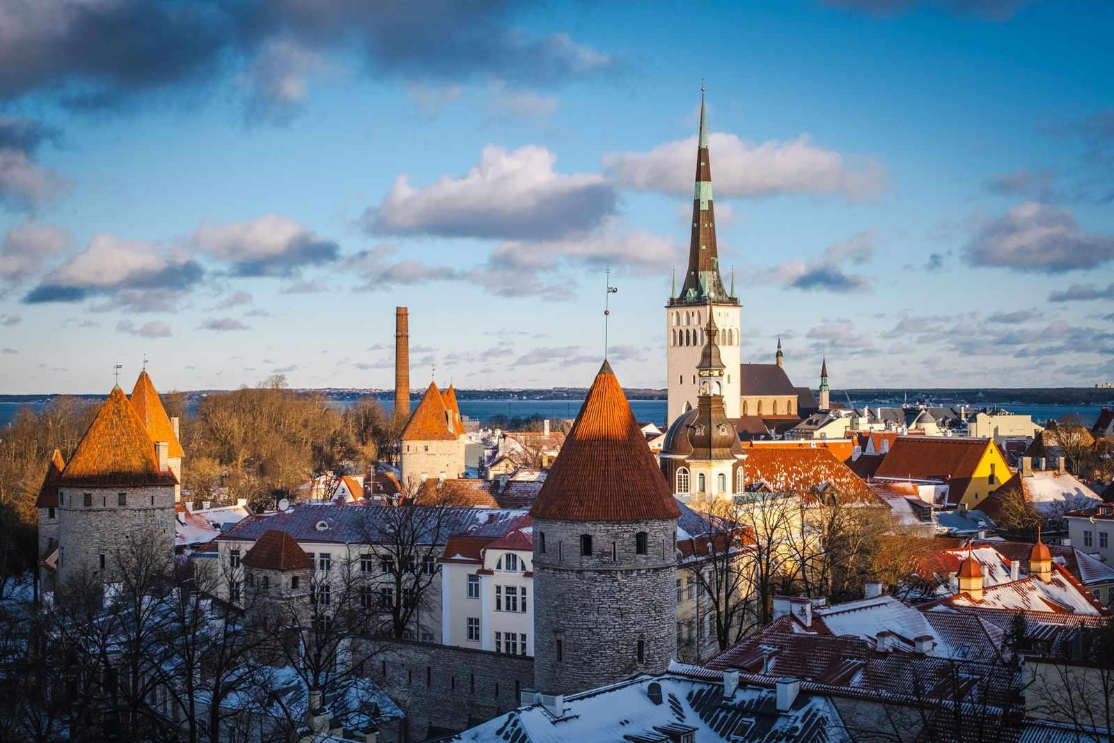Medieval towers and church spires of Tallinn Old Town at sunset