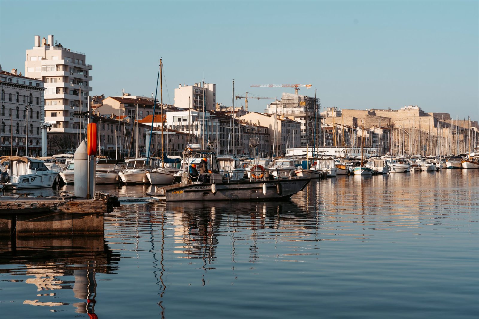 Boats moored in the Old Port of Marseille with the city behind